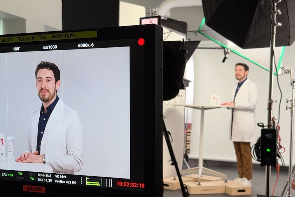 URI College of Pharmacy alum Ethan Melillo films one of his many TikTok videos in his home studio in East Greenwich. Melillo has amassed nearly 500,000 followers, while continuing his full-time job as a pharmacist with L'Oreal.