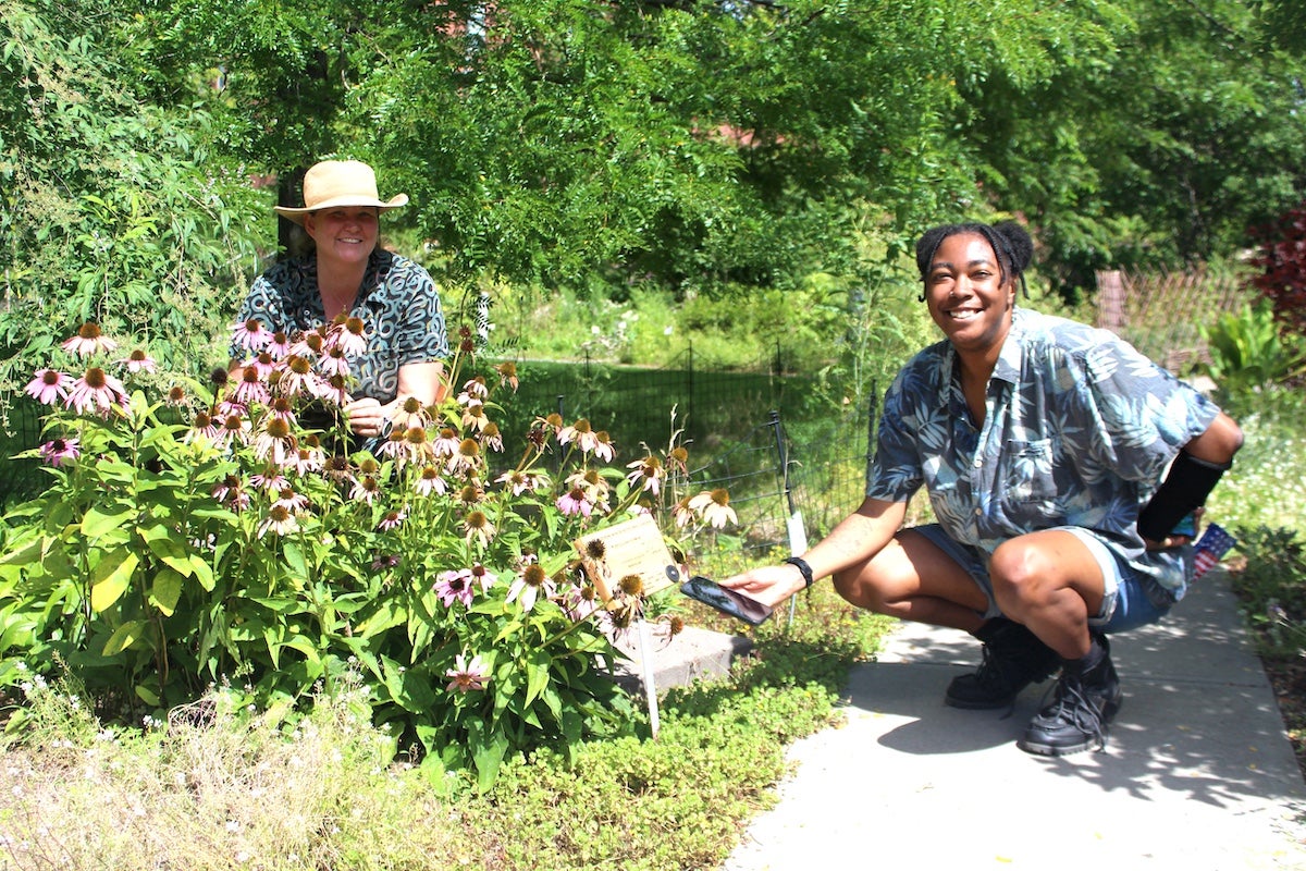 Yvonne Wingard, a URI College of the Environment and Life Sciences graduate and communications fellow (right), is coordinating the Heber W. Youngken Jr. Medicinal Garden audio tour along with garden Coordinator Elizabeth Leibovitz.