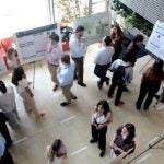 Pharmacy students detail their research projects for professors, fellow students, and passers-by in the lobby of Avedisian Hall during the College of Pharmacy's annual Research Showcase.