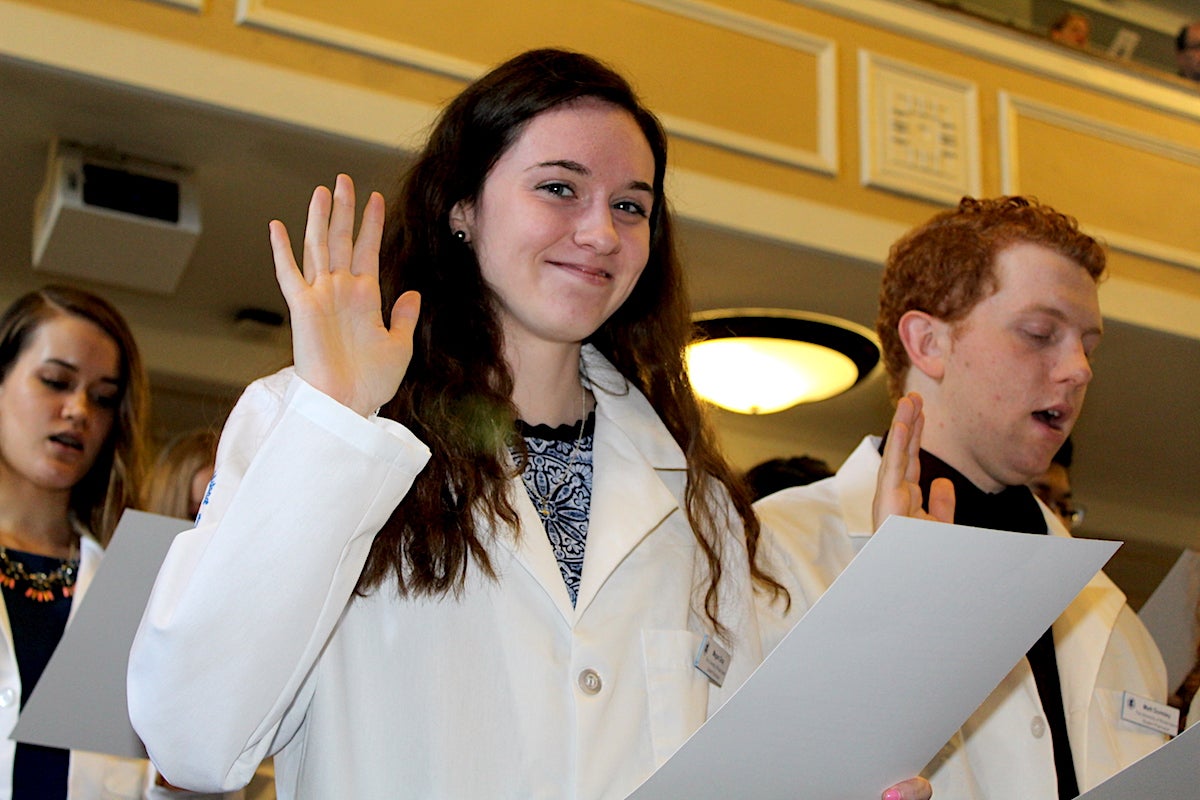 College of Pharmacy student Megan Gray takes the Oath of a Pharmacist during the college’s White Coat Ceremony Oct. 12.