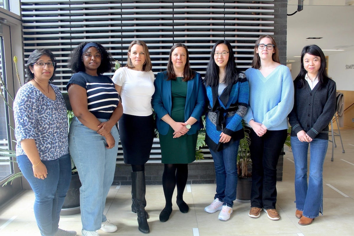 A multi-institution collaboration, led by URI College of Pharmacy Professor Ashley Buchanan, will provide novel insights for HIV intervention among marginalized populations. URI team members (l-r): Anusha Singamaneni, Francisca Ofori, Natallia Katenka, Ashley Buchanan, Jing Wu, Claire Pearsall, Ke Zhang. (URI Photo/Patrick Luce)