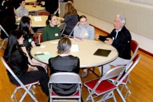 URI pharmacy professor and former Dean Paul Larrat leads a discussion on the variety of opportunities available in the pharmacy industry during a student-organized pharmacy networking event in the Memorial Union.