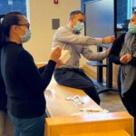 Clinical Professor and Director of Experiential Education Brett Ferret teaches pharmacy technicians to administer vaccines during a training program in 2021.
