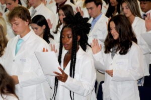 URI College of Pharmacy students recite the Oath of a Pharmacist during the annual White Coat Ceremony Sept. 27.