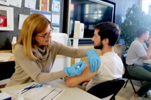 URI pharmacy Clinical Professor Virginia Lemay administers a flu shot during a clinic in Avedisian Hall last year. The College will host an immunization clinic on Oct. 11.