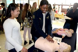 High School student practice CPR