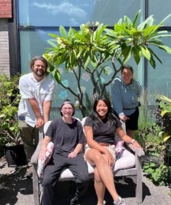 WELCOME: URI green spaces are open to the public, including the Youngken Medicinal Garden; shown, students AJ Chatterton, Ash Lilly and Kate Guinto with coordinator Elizabeth Leibovitz. (URI Photos / K. Curry)