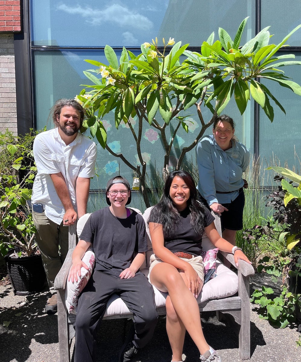 WELCOME: URI green spaces are open to the public, including the Youngken Medicinal Garden; shown, students AJ Chatterton, Ash Lilly and Kate Guinto with coordinator Elizabeth Leibovitz. (URI Photos / K. Curry)