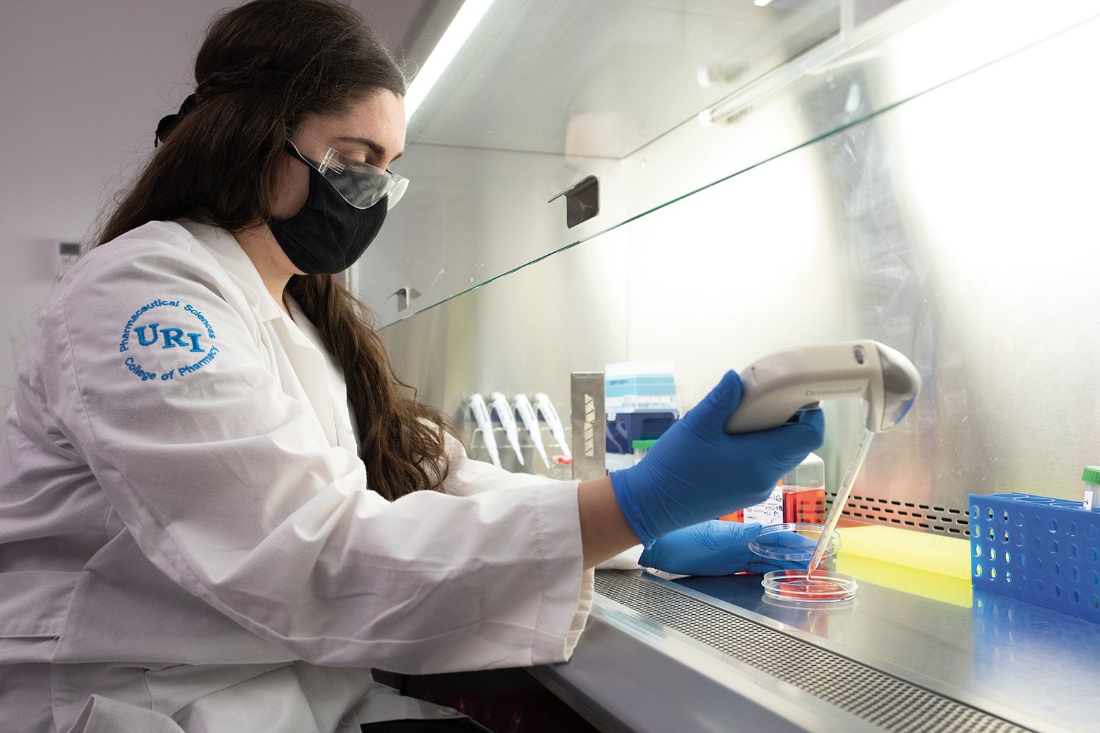 Ph.D. student Lauren Gaspar iresearching micro plastics in a lab