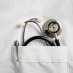 stock image of a stethoscope in a lab coat pocket