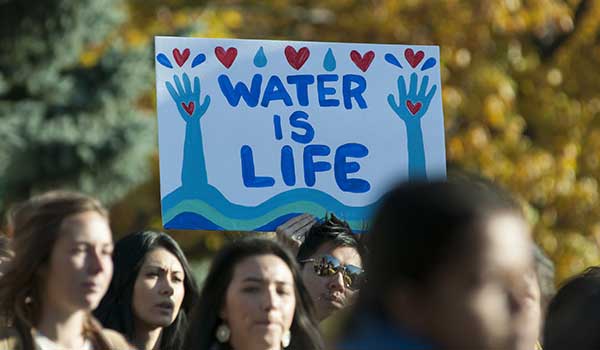 a person holding sign that says 