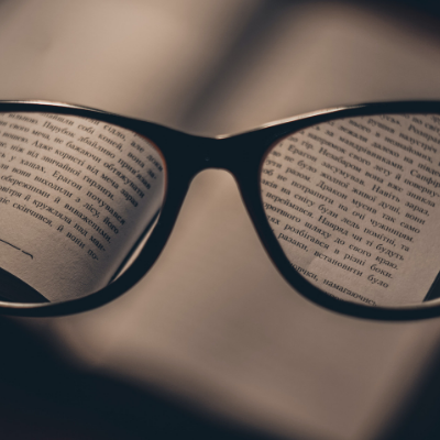 Glasses lense over book