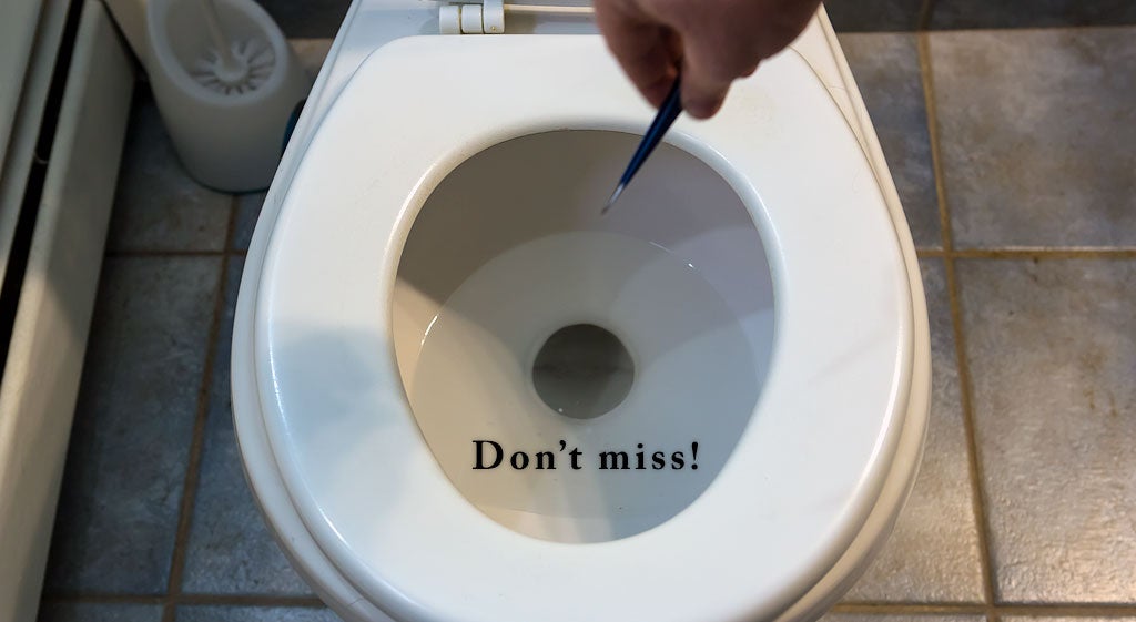 Image of a tick held with tweezers above a toilet with the caption "Don't miss!"