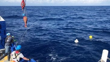 Tossing the grappling hook to snag the CPIES recovery float