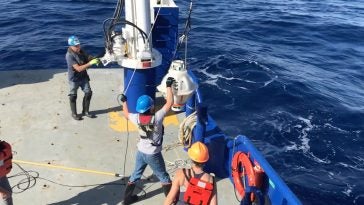 Lowering recovered URI CPIES 137 on to the Pelican's deck