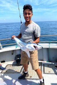 Dario is from Cranston, RI and graduated with a degree in marine biology.  He was a volunteer at Mystic Aquarium as an exhibit educator for the California sea lions, harbor seals, northern fur seals, and spotted seals. He also worked with Rhode Island DEM Marine Fisheries as a field technician. Dario analyzed tag and recapture data for southern stingrays at the world-famous Stingray City in the Cayman Islands to investigate abundance, composition and temporal trends of the stingray aggregation over the past decade.  While at URI Dario loved fishing and time on the boat for the mako shark research at URI.  In the summer of 2021 Dario was one of four students in the country working as a National Geographic Society STEM Field Assistant.