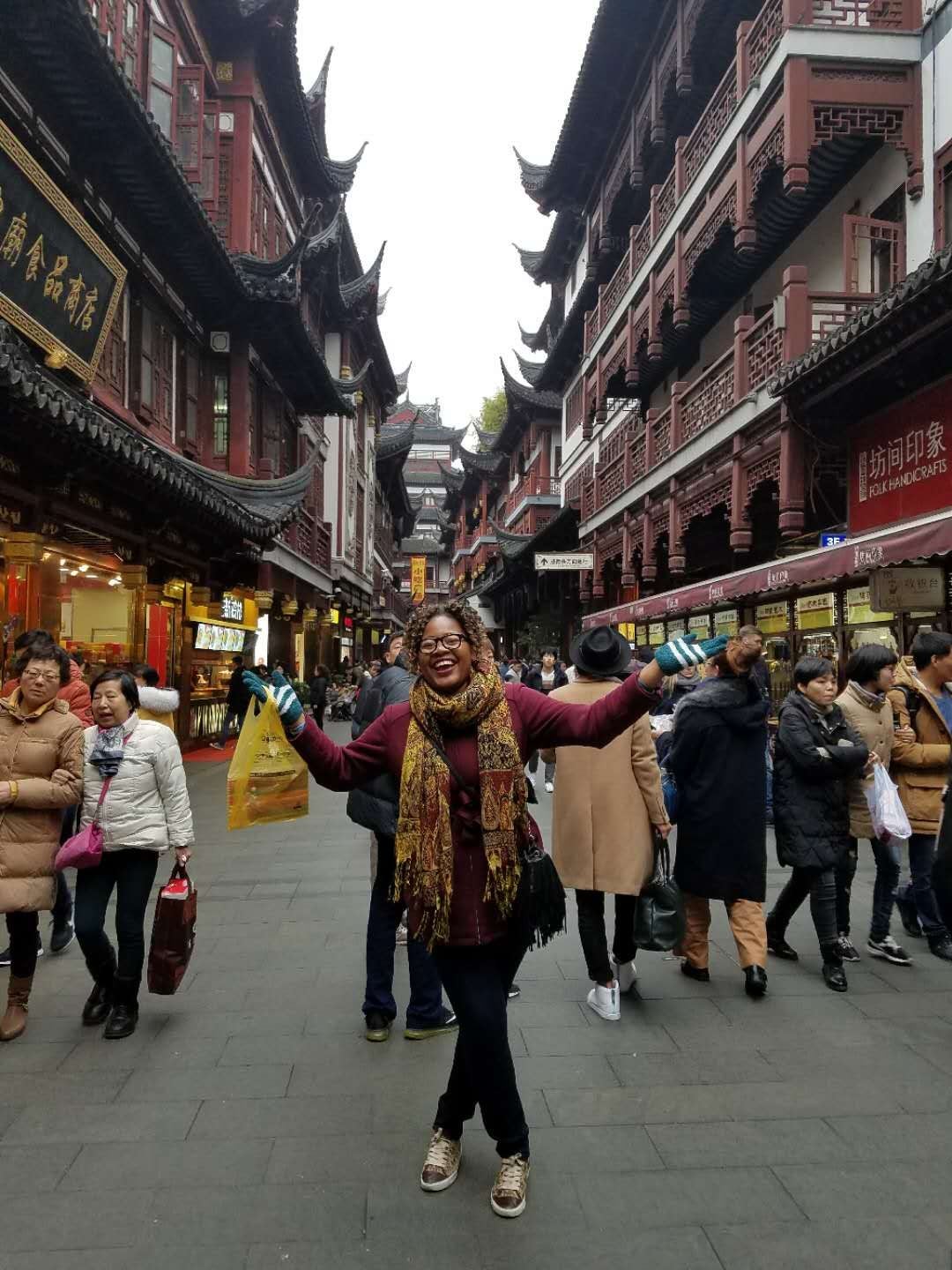 Cynthia Malambi standing in a crowded street in Shanghai