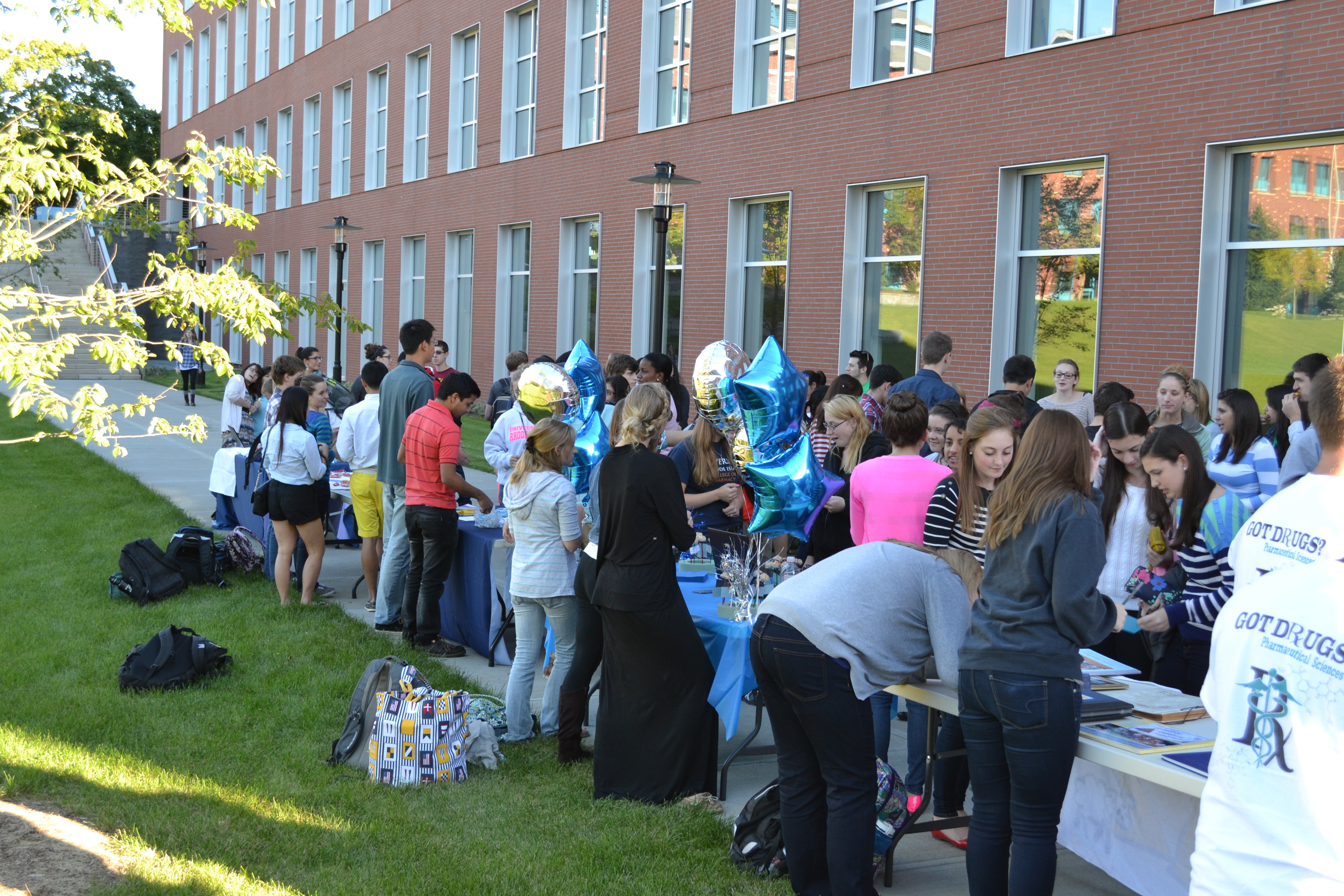 students at staff attending fair outside of avedisian hall