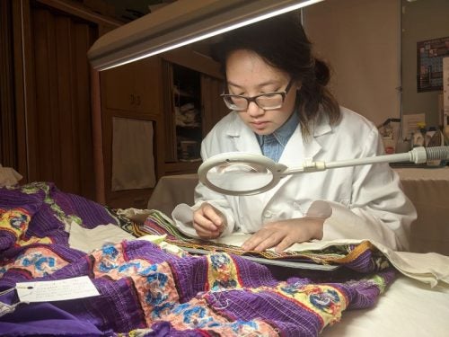 Student working with ethnic garments