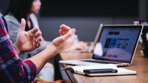 Closeup of hands gesturing at a meeting