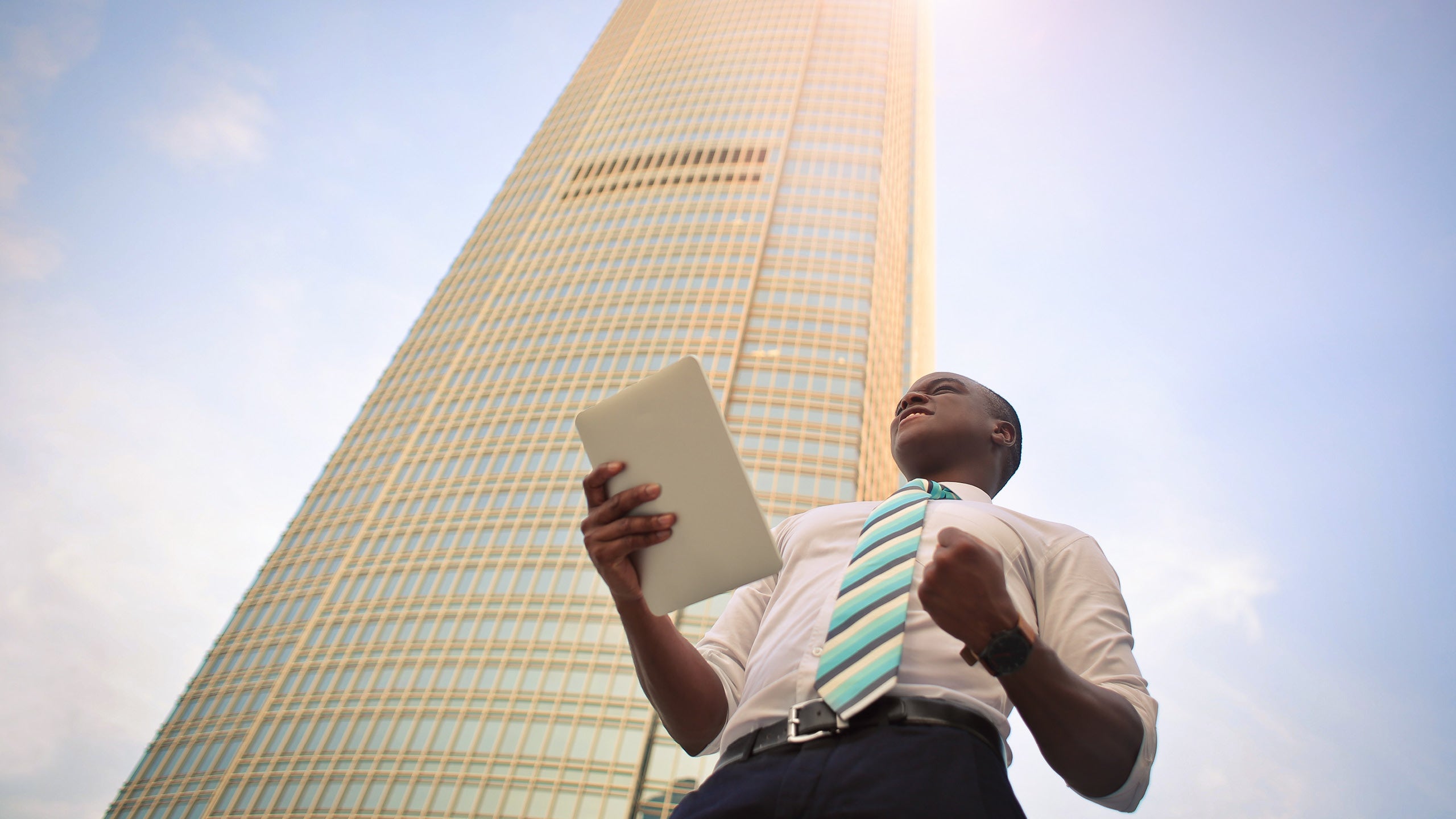 businessman in front of tall building