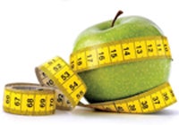 green apple wrapped in measuring tape