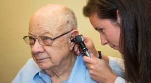 client receiving ear exam
