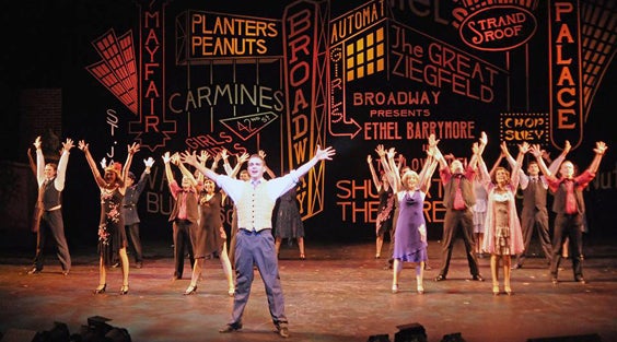 A musical number from a production of Singin' in the Rain