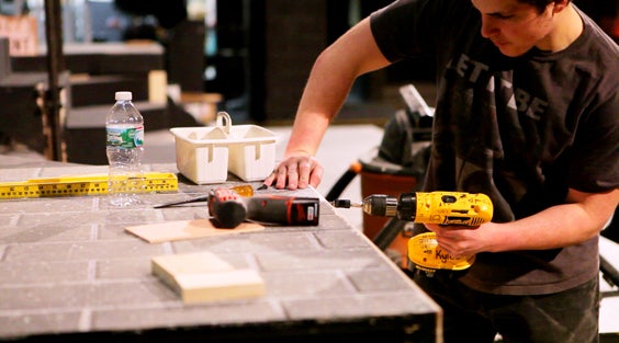 A student building a stage set