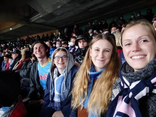 Students at a soccer game in Italy