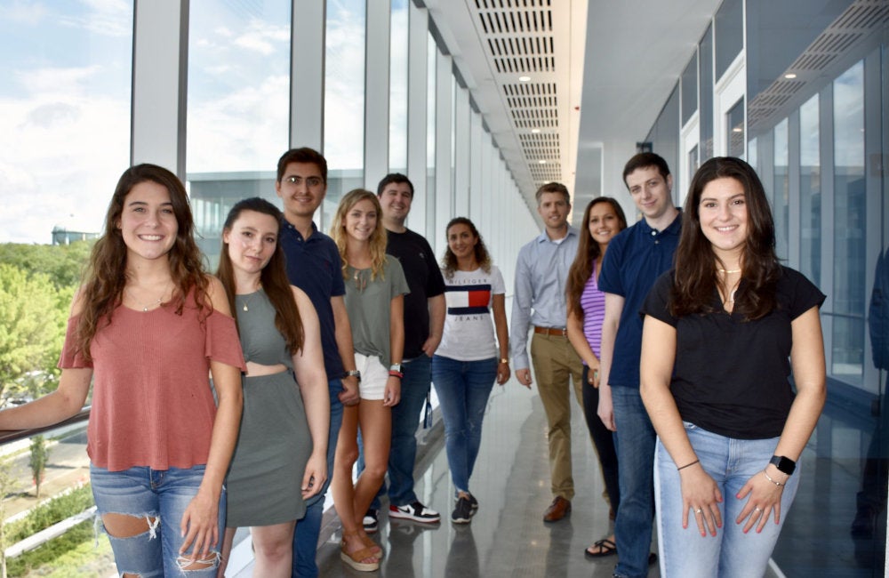A group shot of students working in the NanoBio Engineering Laboratory
