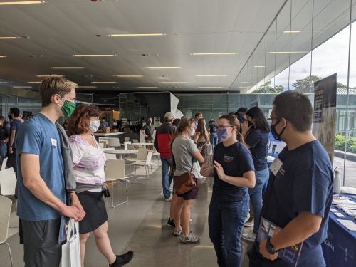 Prospective students talking to current URI students