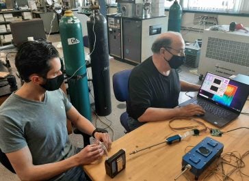 Peter Ricci and Otto Gregory work on sensors