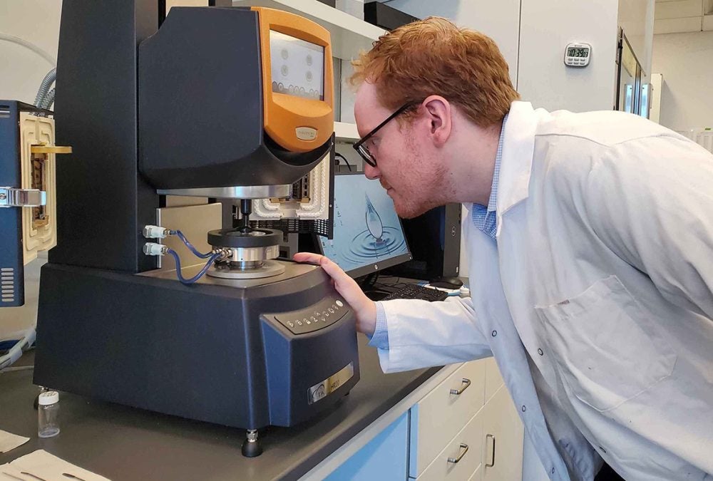 Ryan Poling-Skutvik inspecting a material on the rheometer