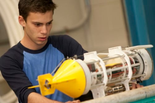 A student works on a submersible drone