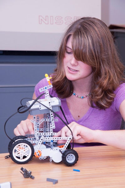 high school student working with robotics