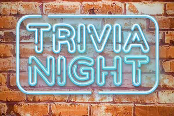 Blue neon Trivia Night sign in front of a brick wall