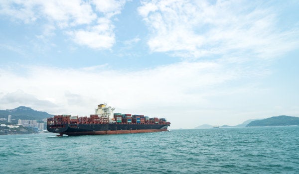 A cargo ship leaving a port in Hong Kong
