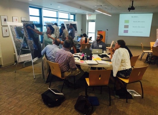 A group of policymakers working with researchers at URI on a vulnerability assessment