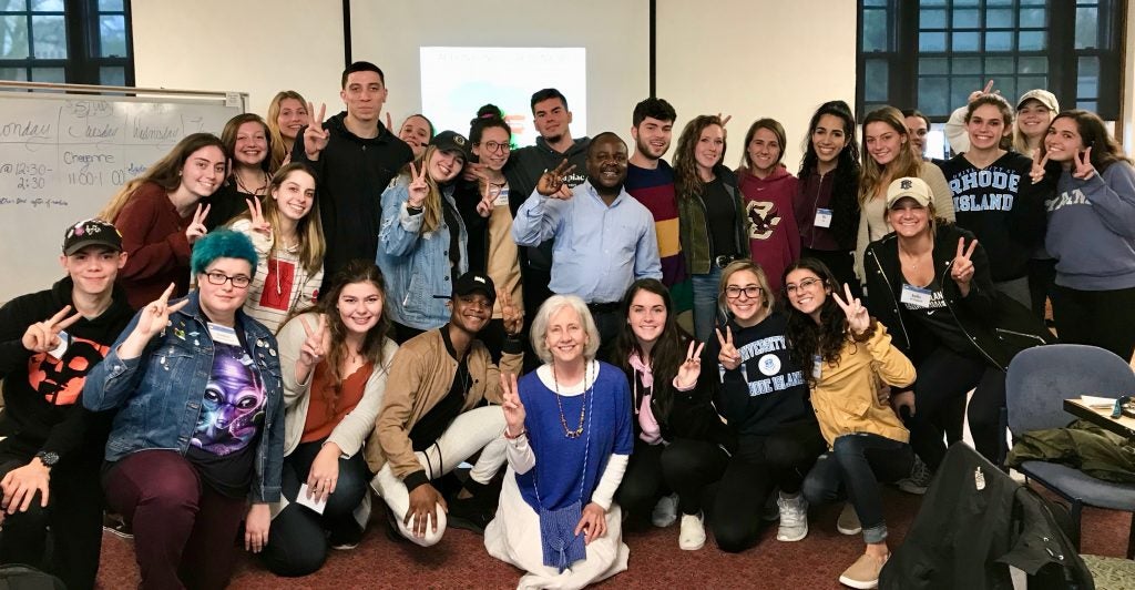 PSY 479 class holding up the hand sign for peace