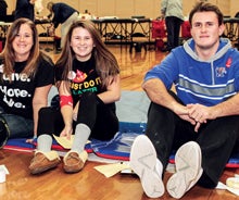 North Kingstown High School students at a blood drive in the gymnasium.