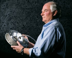 Jim Harris holds the invention that is a critical part of the probe, enabling it to collect a sample in the harsh conditions of space.