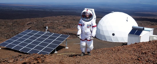 Science officer Christiane Heinicke outside the solar-powered dome on the northern slope of Mauna Loa volcano in Hawaii. Bottom left, a NASA photo of the planet Mars.
