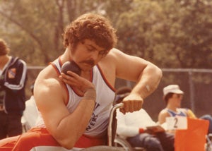 DePace readies himself before competing in shot put at a national wheelchair sports meet in the 1970s.