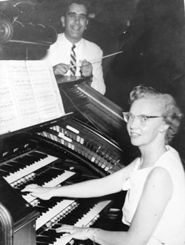 Top, Abusamra singing at commencement; above, with his wife Barbara.