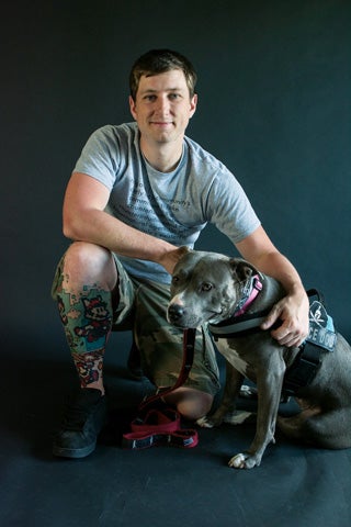 Alex Reppe with his service dog, Icey,