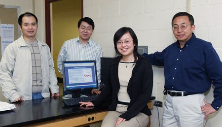 Professors Yan Sun and Quing Yang, foreground left to right, with graduate students Jin Ren, left, and Yafei Yang, who  is one of the inventors of the patent.