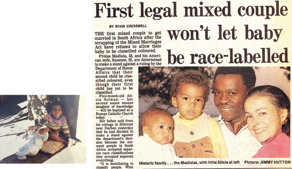 Above left, Darius with baby Alicia; at right, news clipping announcing the couple’s refusal to classify their children.