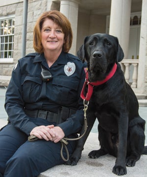 A PAWS IN THE ACTION: Officer Figaro “is such a sweet dog, the loviest dog ever. But he becomes serious when he goes to work,” says his trainer, URI Police Sgt. Erica Vieira.