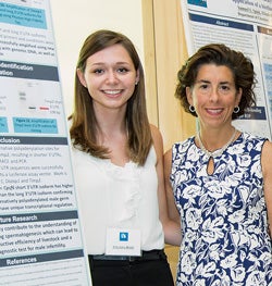 Rhode Island Governor Gina Raimondo speaks with undergraduate researcher Amanda Rode ‘18 during the Summer Undergraduate Research Fellowship at Kingston on July 31.